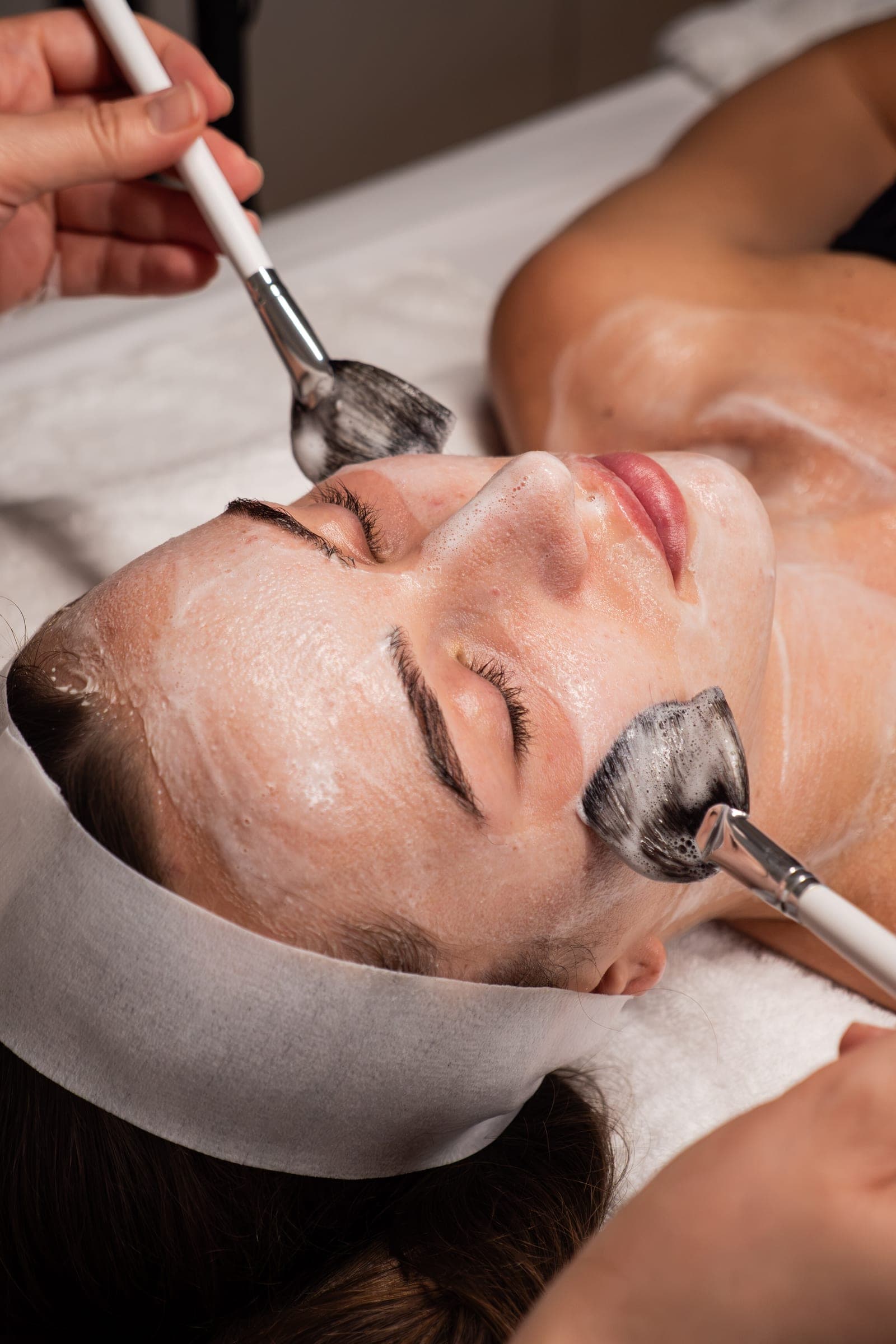 Enzyme masque brushed onto a client's skin during a pre-event facial at Skin Study Med Spa in Plano, TX